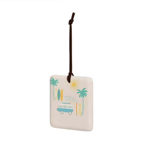 A square cream hanging tile magnet ornament with an illustration of an RV, surfboards and palm trees, displayed angled to the left.