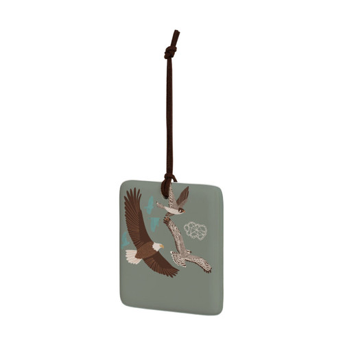 A square dark green hanging tile magnet ornament with an illustration of birds in flight, displayed angled to the left.