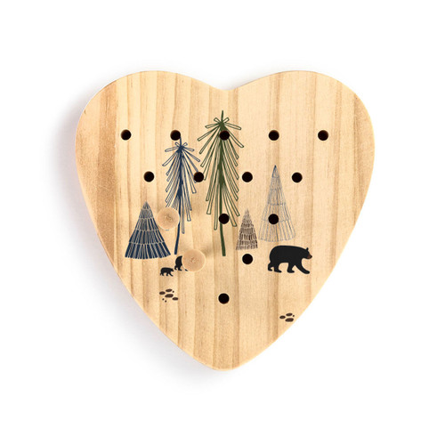A wood heart shaped peg game with an illustration of bears in the forest, displayed with two wood pegs in the game.