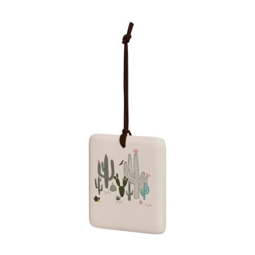A square cream hanging tile magnet ornament with an illustration of different cacti, displayed angled to the left.