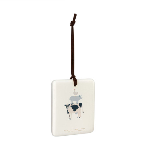 A square cream hanging tile magnet ornament with an illustration of a cow, pig and chicken, displayed angled to the right.