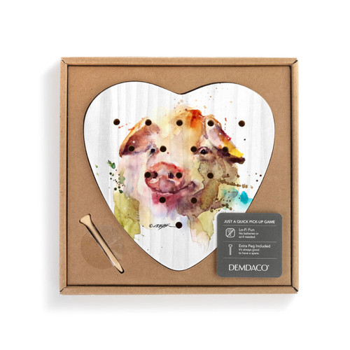 A white wood heart shaped peg game with a watercolor image of a pig's face, displayed in a packaging box.