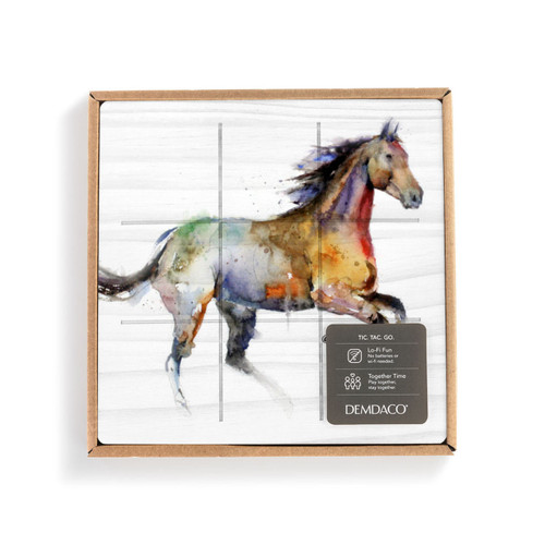 A square white wood board for tic tac toe with a watercolor image of a running horse, displayed in a packaging box.