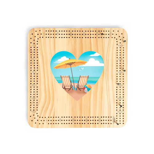 A light wood cribbage board game with heart shaped graphic artwork of two beach chairs and an umbrella in the middle.