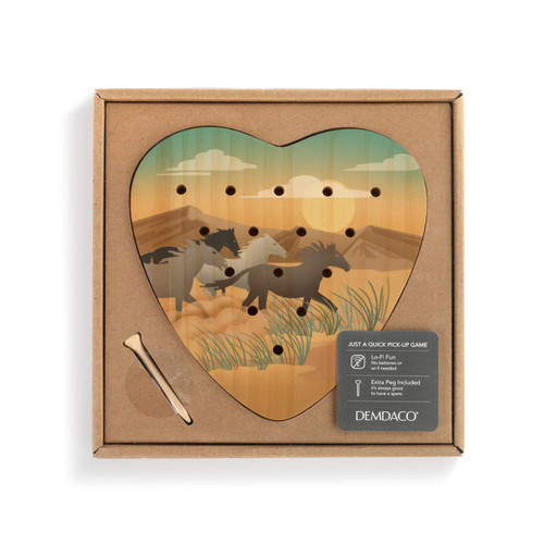 A wood heart shaped peg game with graphic artwork of horses running in a southwest setting, displayed in a packaging box.