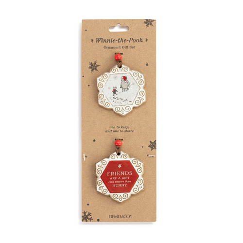 Two ornaments with one meant to share. One has an image of Pooh and Piglet and the other says "Friends are a gift even sweeter than hunny", displayed on a packaging card.