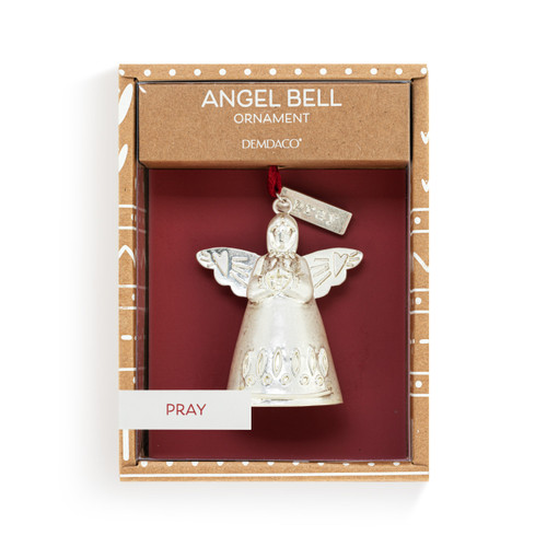 A mini white bell ornament shaped like an angel with hands folded in prayer. There is a tag at the top with the word "Pray", displayed in a packaging box.