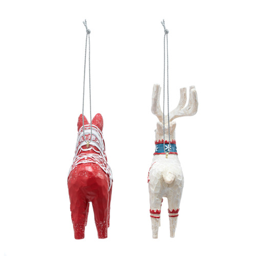 Back view of a red horse and white deer carved ornaments decorated in Scandi style.