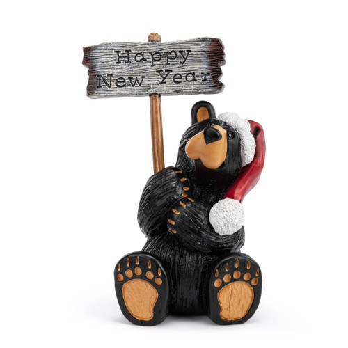 A grand figurine of a sitting black bear wearing a Santa hat and holding a sign that says "Happy Holidays". The sign is reversible and removable, displayed with the reverse side up that says "Happy New Year".