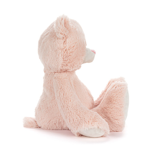 Right profile view of a light pink plush bear with "My First Teddy" embroidered on the paw of his left leg.