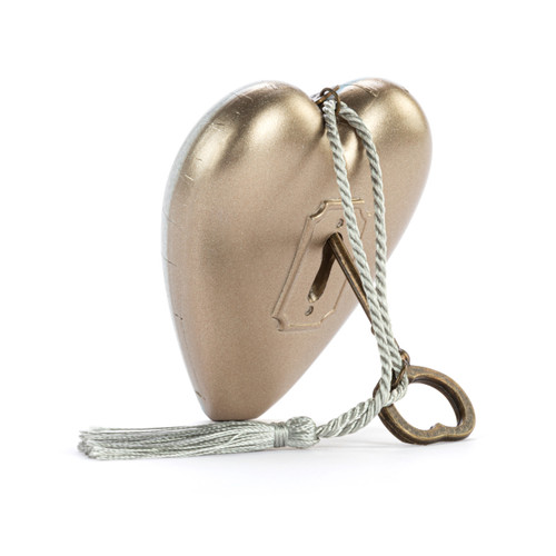 Back view showing the heart propped on the key for a heart shaped sculpture with a silver tassel and metal key attached. The heart has a light gray background and says "How long will we be friends?" asked Piglet. "How long is forever?" said Pooh.