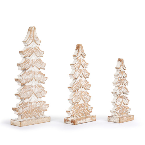 A set of three whitewashed flocked wood carved trees in various sizes, displayed angled to the right.