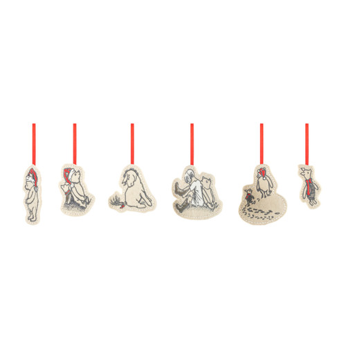 A set of six different plush cream ornaments on red ribbon hangers. They are all images of various Winnie-the-Pooh characters, displayed angled to the left.