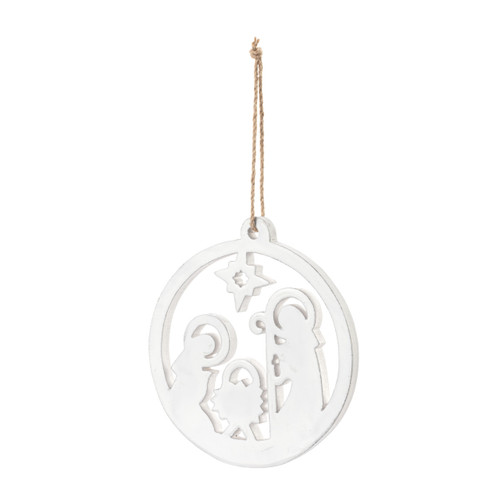 A white enamel round wood ornament with a cutout of the nativity scene, displayed angled to the left.
