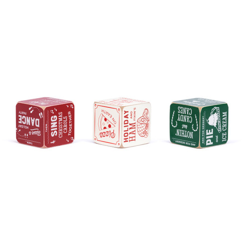 A set of three red and green painted wood dice with instructions on them for a holiday dinner, dessert and activities, displayed showing different sides.