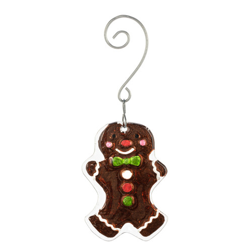 A glass ornament of a traditional decorated gingerbread man cookie with a curved silver hanger.
