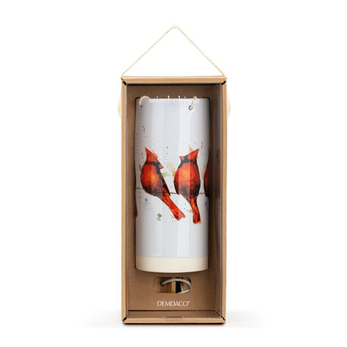 A white tubular ceramic wind chime with a wood chime. There are watercolor cardinals perched on a wire around the outside, displayed in a packaging box.