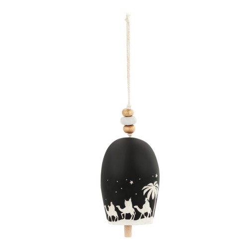 Back view of a black decorative bell with the nativity scene in white and beads at the top.