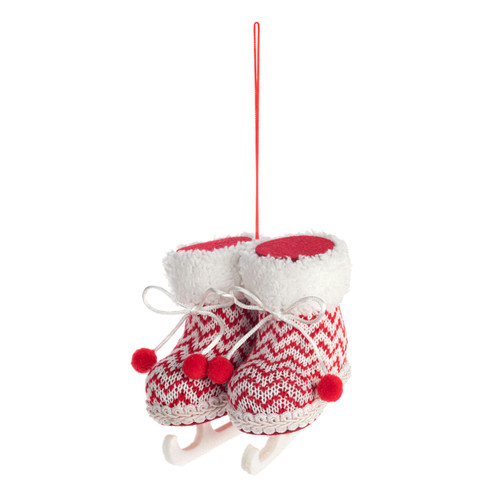 A hanging ornament of red and white fabric knit ice skates, displayed angled to the left.