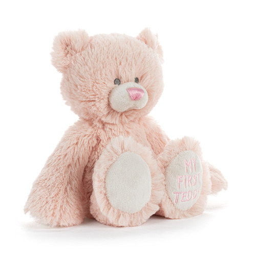A mini light pink plush bear with "My First Teddy" embroidered on the paw of his left leg, displayed angled to the right.