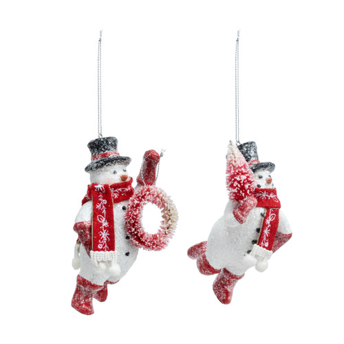 A set of two different snowman ornaments. Each is wearing red boots, scarf and a black top hat while holding either a wreath or small red tree, displayed angled to the right.