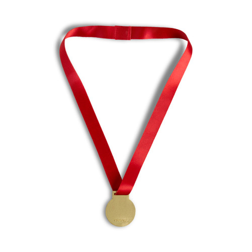 Back view of a gold and red medal on a red ribbon that says "Kindness Award".