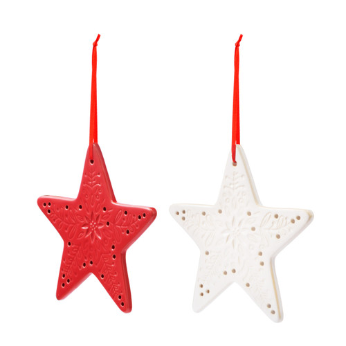 A set of two star shaped ceramic ornaments, one red and one white, displayed angled to the left. The ornaments have decorative markings and holes.