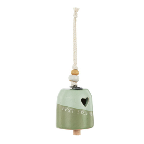 A mini light and dark green bell with a cut out heart and says "Best Friends". There are beads and a metal token at the top of the bell, displayed angled to the right.