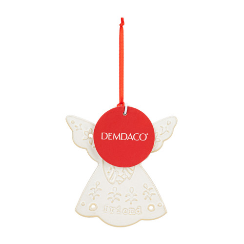 A white mini angel ornament hanging from a red ribbon. The ornament has the saying "friend" with decorative holes and images on the ceramic, displayed with a tag attached.