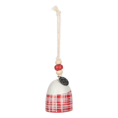 A mini white and red bell with a plaid pattern. There are beads and a metal token at the top of the bell, displayed angled to the right.