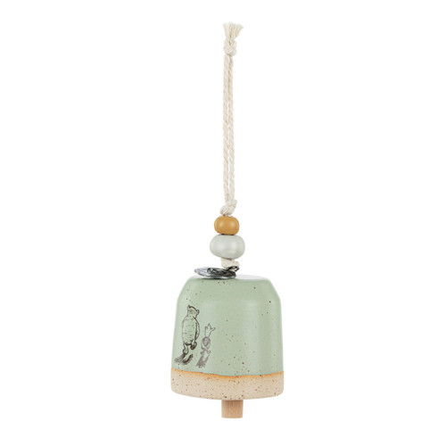 A mini tan and green bell with an image of Pooh and Piglet walking together. There are beads and a metal token at the top of the bell, displayed angled to the left.