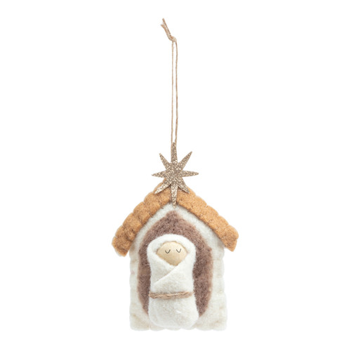 A felted ornament in brown and white of Baby Jesus and the stable.