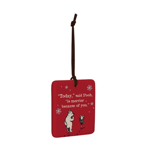 A square red hanging tile magnet ornament that says "Today" said Pooh, "is merrier because of you" with an image of Pooh and Piglet, displayed angled to the right.