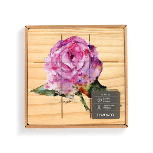 A square wood board for tic tac toe with a watercolor image of a pink rose, displayed in a packaging box.