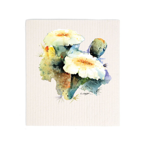 A white biodegradable dish cloth with a watercolor image of a flowering saguaro cactus.