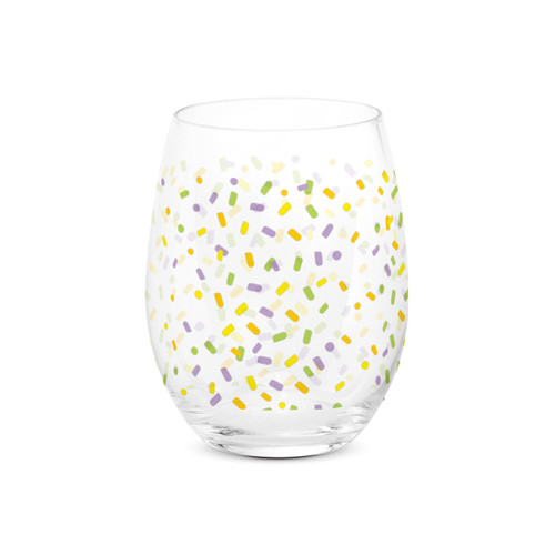 A clear stemless wine glass with a colorful confetti pattern all around the glass.