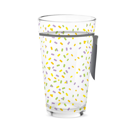 A clear pint glass with a colorful confetti pattern, displayed with a product tag attached.