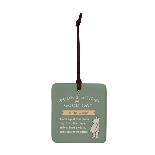 A square green hanging tile magnet ornament that says "Pooh's Guide for a Good Day in the woods" with an image of Pooh.
