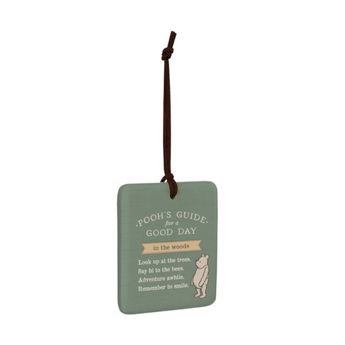 A square green hanging tile magnet ornament that says "Pooh's Guide for a Good Day in the woods" with an image of Pooh, displayed angled to the right.