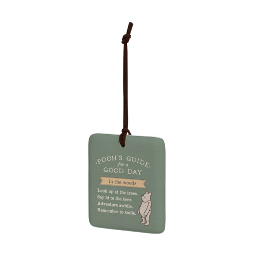 A square green hanging tile magnet ornament that says "Pooh's Guide for a Good Day in the woods" with an image of Pooh, displayed angled to the left.