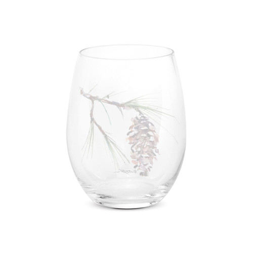 Back view of a clear stemless wine glass with a watercolor image of a white pine branch.