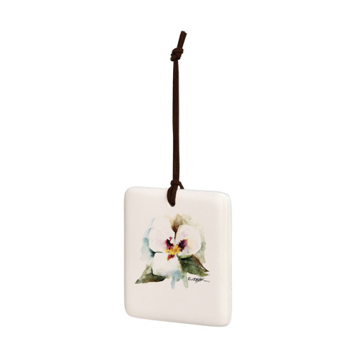 A square cream hanging tile magnet ornament with a watercolor image of a sego lily, displayed angled to the left.