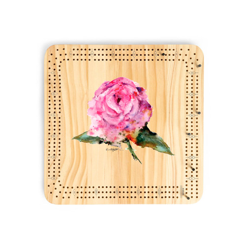 A light wood cribbage board game with the watercolor image of a pink rose in the middle.