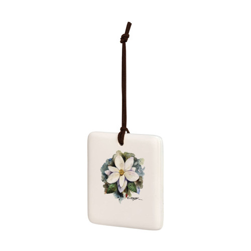 A square cream hanging tile magnet ornament with a watercolor image of a white magnolia, displayed angled to the left.