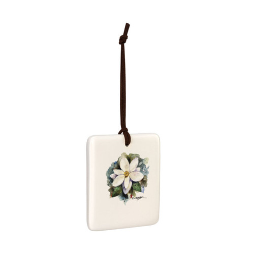 A square cream hanging tile magnet ornament with a watercolor image of a white magnolia, displayed angled to the right.