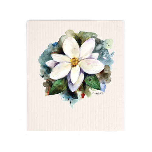 A white biodegradable dish cloth with a watercolor image of a white magnolia.