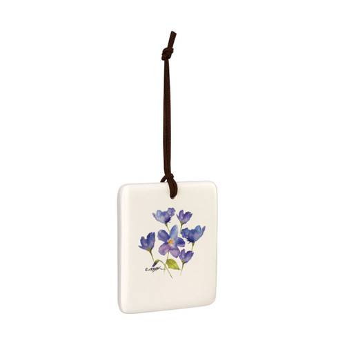 A square cream hanging tile magnet ornament with a watercolor image of a purple violet, displayed angled to the right.
