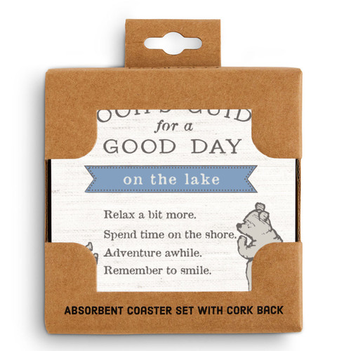 A set of four cream square ceramic coasters that say "Pooh's Guide for a Good Day on the lake" with an image of Pooh and Piglet, displayed in a packaging box.