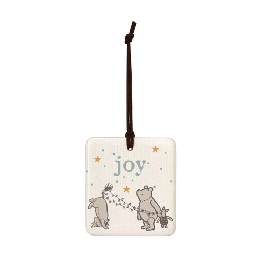 A square cream hanging tile magnet ornament that says "Joy", with an image of Pooh, Piglet and Eeyore at the bottom.