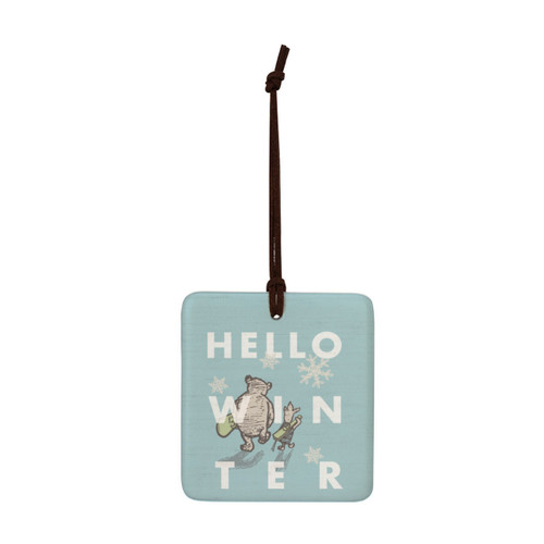 A square light blue hanging tile magnet ornament that says "Hello Winter", with an image of Pooh and Piglet walking with skis.